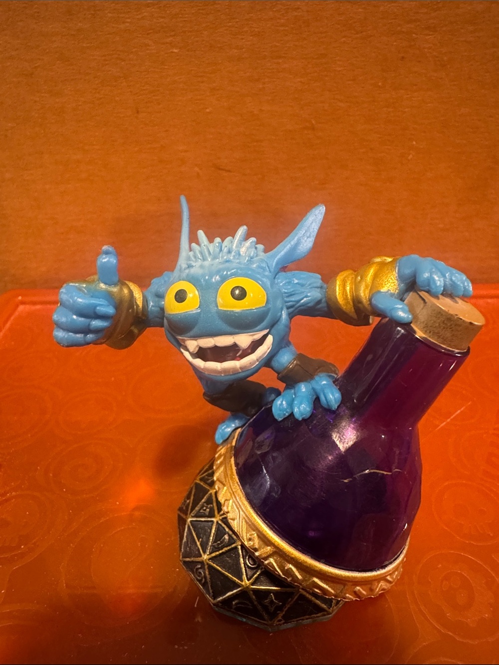 Blue Goblin Figure on Purple Potion Bottle Figurine